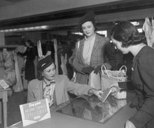 Woman buys a book of National