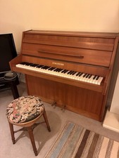 Small upright piano, John