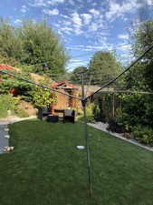 Rotary washing line including cover