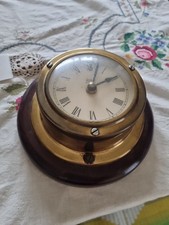 Vintage Brass Clock On Wooden