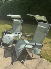 Pair Of Zero Gravity Chairs. Complete With Sun Canopy & Each Has Carry Case.