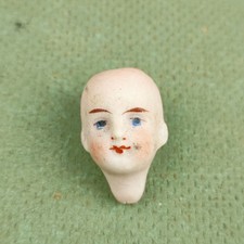 Antique dollhouse doll head