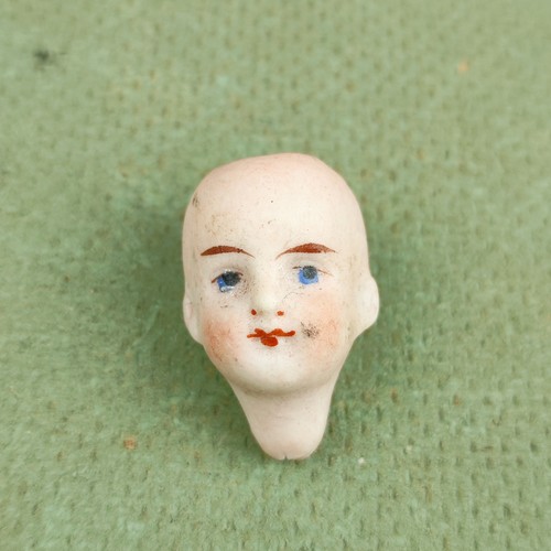 Antique dollhouse doll head