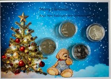 XMAS Paddington set of 4 mint uncirculated  50P commemorative coins .