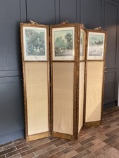 FRENCH GILTWOOD DRESSING SCREEN, WITH 18th century printed panels.