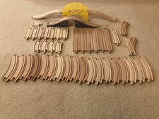 wooden train set for kids including track, bridges, trains, accessories.