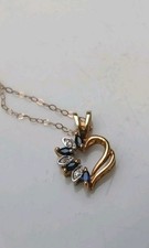 9 Carat Gold Diamond And Sapphire Necklace. 1.23g