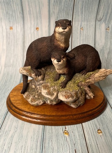 Border fine arts otters - , (