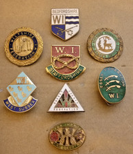EIGHT VINTAGE ENAMEL BADGES