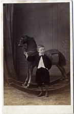 Young boy standing with rocking horse 1860s cdv