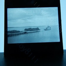 steam Tug boat pulling scrap barges magic lantern