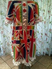 Multi coloured Panto Dame, White ribbon 50" chest, Red buttons