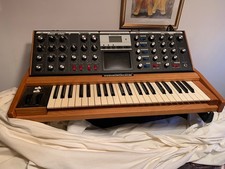 minimoog voyager hardly used never left house, brown wood  outer case