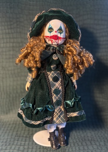 Redhead clown porcelain doll