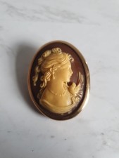 Vintage Cameo Brown Background