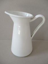 An 8 ¾” Ikea White Enamel