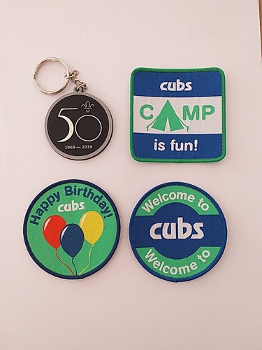 Cub uniform badges and - x, x