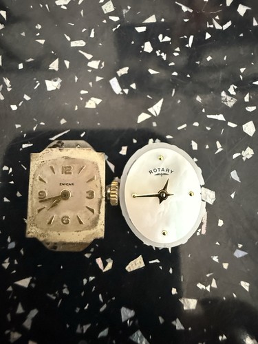 Two tiny watch faces - tiny, (taken