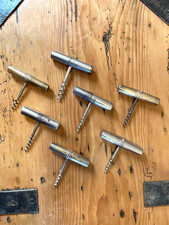Collection of vintage antique barrel travel corkscrews with additional tools