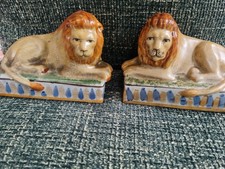 Pair of Staffordshire Recubent Lion Ornaments