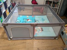 Large children's playpen with reversible soft mat