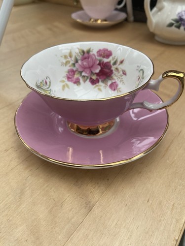 Pink cup and saucer - and,