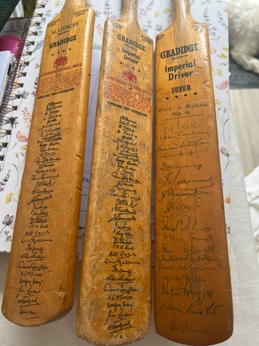 Three mini cricket signed