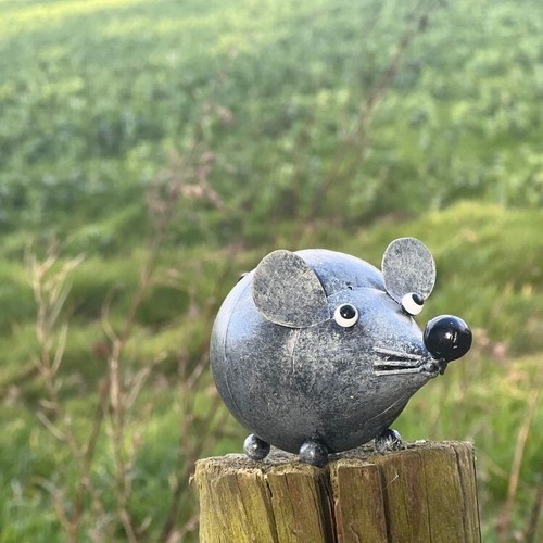 Hand crafted metal grey mouse - hand,