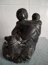 Inuit mother,Baby And Dog.