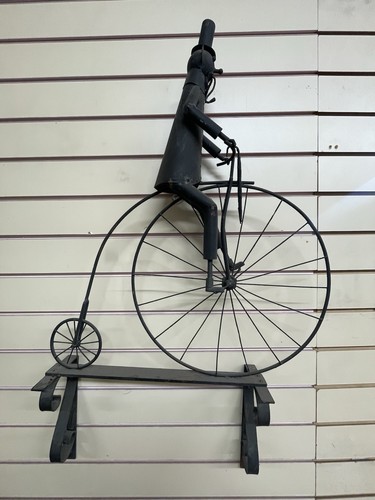 Man penny farthing bike - man,
