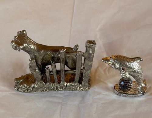 Pewter dog and dolphin