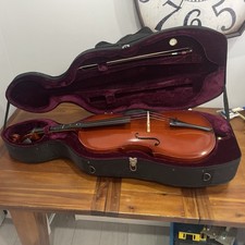 Cello size 1/2 in hard black wheeled carry travel case shell with bow