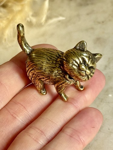Cheeky brass cat figurine with - cat,