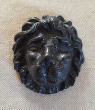 Carved lions head - a, black