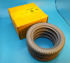 Meccano yellow trade box of four 3 inch grey Tyres, part 142b.