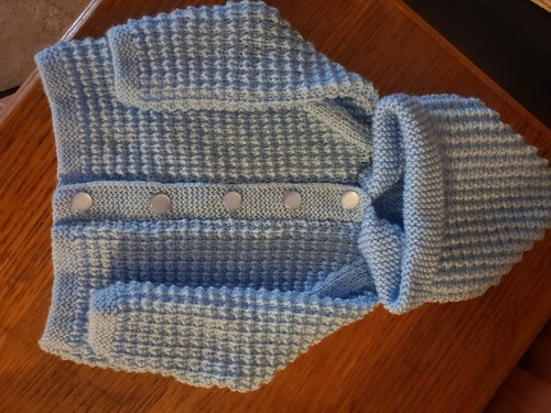 Hand knitted baby - hand,