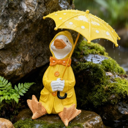 Duck holding umbrella statue - holding,