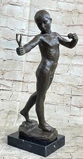 Nude male figure holding - nude,