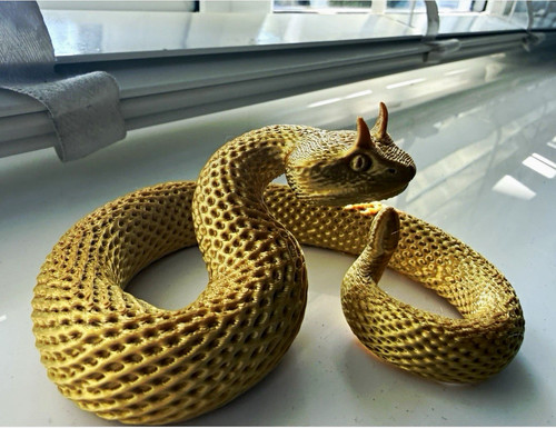 Gold metallic coiled snake - coiled,