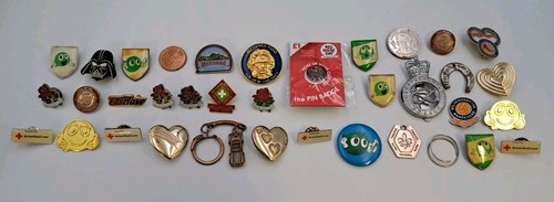Assorted metal badges and