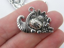 4 Cornucopia pendants  tibetan