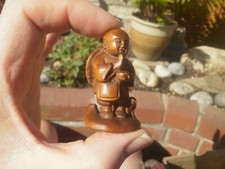 1a. Carved wood netsuke boy