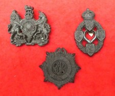 3 Plastic WW 2 cap badges