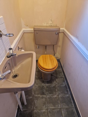 Toilet and sink set used - toilet,