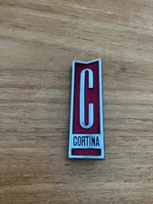 A very nice  original Ford Mk2 Cortina red Grille Badge 3014-88141-A