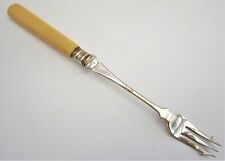 Y664) Vintage cream white handle metal pickle fork 
