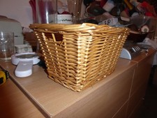 small wicker storage basket with handles