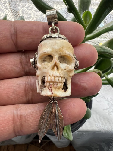 Skull carved set with coral - carved,