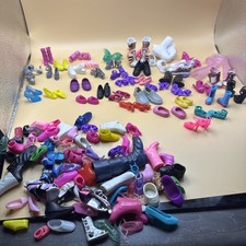 Around 44 pairs of doll shoes