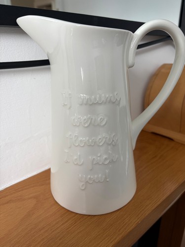 Cream coloured ceramic jug